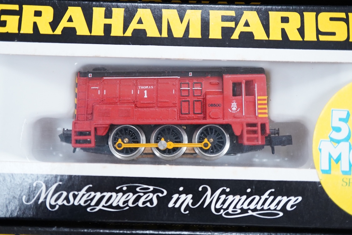Four boxed Graham Farish N gauge railway Class 08 0-6-0 diesel locomotives; a BR, D3729 (371-001), a BR Railfreight, 08 834 (1008), an EWS, 08921 (100G) and a Thomas 1, 08500 (1006).